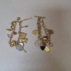 TWO CHARM GOLD BRACELETS.